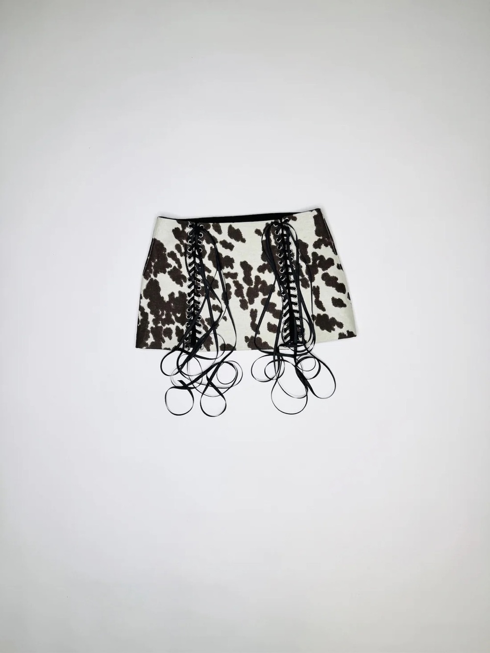 Cowprint Lace-Up Mini Skirt in Black and White